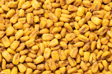 Roasted salted corn snack. Pattern of yellow corn seed.