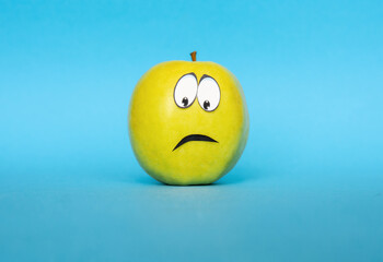 negative emotions from fear to panic, sad Face on an apple - abstract image of human emotions on...