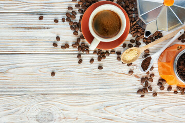 fresh cup of coffee, geyser coffee maker and coffee grains on the table. roasted coffee heap. Arabic roasti	
