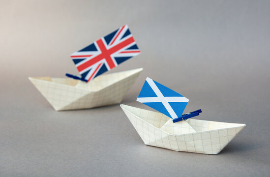 Paper Ships With The Scotland And The UK Flag -  Relations   In The Kingdom, Independence And A Referendum Concept