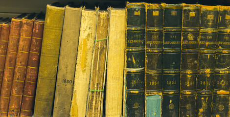Shelf with old books from the middle of the 19th century