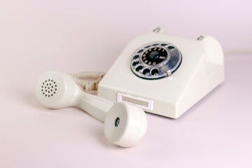 Vintage phone on light pastels background. Communication 80s. minimal concept.