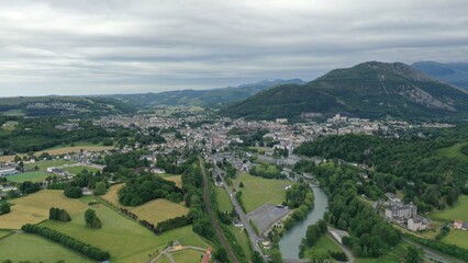 Fototapeta na wymiar survol de la ville de Lourdes dans le piémont des Hautes-Pyrénées