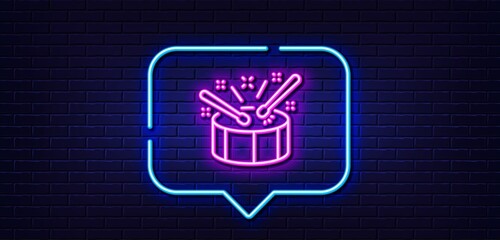 Neon light speech bubble. Drums with drumsticks line icon. Music sign. Musical instrument symbol. Neon light background. Drums glow line. Brick wall banner. Vector