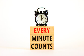 Every minute counts symbol. Concept words Every minute counts on wooden blocks on a beautiful white table white background. Black alarm clock. Business, motivational and every minute counts concept.