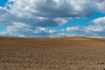 Rows of soil before planting. Drawing of furrows on a plowed field prepared for spring sowing of...