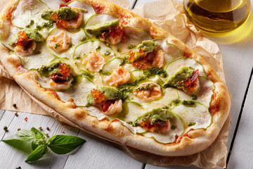 Roman pizza with broccoli, red caviar, zucchini slices and tomato sauce