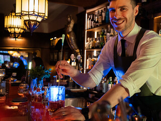 happy bartender mixing drink