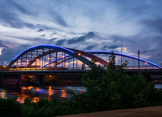 Bridge over River Elbe in Germany at blue hour after summer Sunset with colorful illumination and longtime exposure