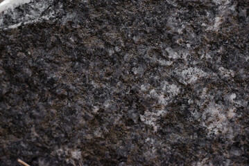 Texture of old raw granite close-up