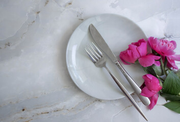 Empty plate flower peony on marble background