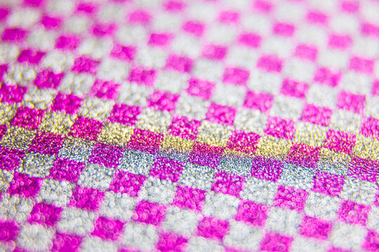 square texture, Abstract colourful purple creative macro bokeh background. Multi colored glitter becoming defocused, shining bokeh, selective focus