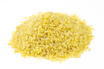 Pile of dry bulgur raw grain on white background. Heap of dry bulgur close up.