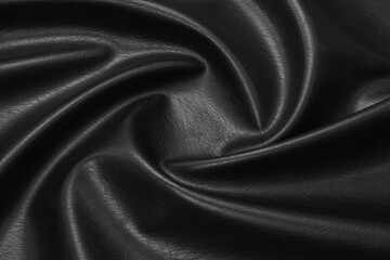 Fototapeta premium black artificial leather with waves and folds on PVC base