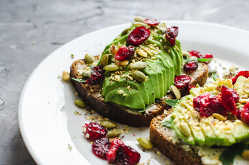Healthy avocado toasts for breakfast or lunch with rye bread