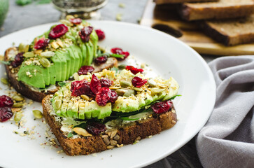 Healthy avocado toasts for breakfast or lunch with rye bread