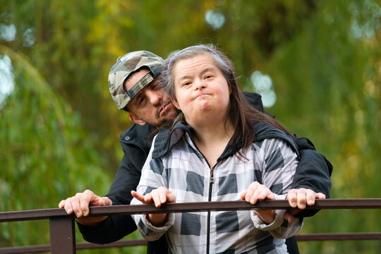 Down syndrome love couple in park