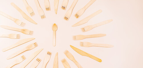 Disposable wooden cutlery.Eco concept.Banner eco friendly disposable kitchenware utensils on white background.Wooden forks,spoons,zero waste.Copy space.Eco friendly wooden cutlery.plastic free concept