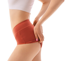 Young woman wearing red period panties on white background