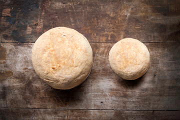 Fototapeta na wymiar Loaf of white bread on a wooden table