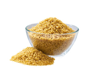 dry bulgur in a glass plate and scattered isolated on white background.