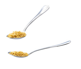 metal spoon with bulgur isolated on white background.