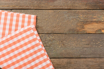 Obraz premium New checkered napkins for picnic on wooden background