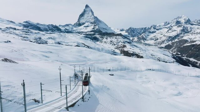 Swiss beauty, a rack railway going to Gornergrat train station under breathtaking Matterhorn, Zermatt, Valais, Switzerland, Europe. A train through Switzerland.