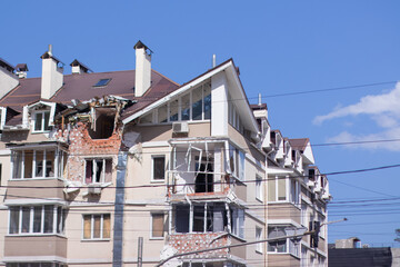 consequences of russian war crimes. destroyed houses in irpin city, ukraine. mortar shell hit...