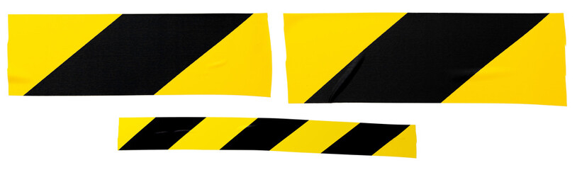 Yellow-black sticky tape, torn horizontal and sticky pieces of different sizes, isolated on white background. Set of yellow-black tapes.
