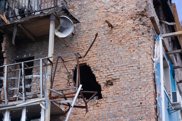 consequences of russian war crimes. destroyed houses in irpin city, ukraine. mortar shell hit...