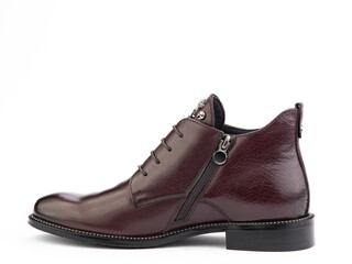 Men's autumn brown leather jodhpur boots with laces and average heels, isolated white background. Left side view. Fashion shoes.