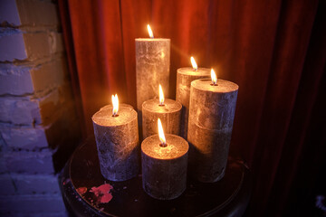 Set of burning candles on the table