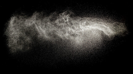 Sprayed water. Splashes and drops of water isolated on black background.