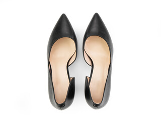 Classic and elegant high-heeled women shoes. Stylish black shoes on high thin heels and with a pointed toe. Isolated object close up on white background. Top view.