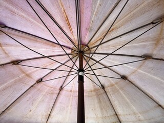 close up old umbrella and iron pole
