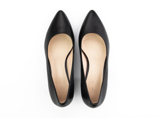 Classic and elegant high-heeled women shoes. Stylish black shoes on high thin heels and with a pointed toe. Isolated object close up on white background. Top view.