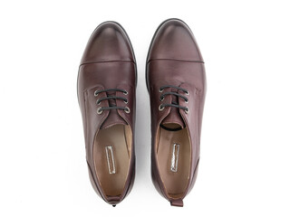 A pair of classic leather elegant men's shoes isolated white background. Groom's stylish black shoes. Isolated object close up on white background.