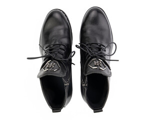 A pair of classic leather elegant men's shoes isolated white background. Groom's stylish black shoes. Isolated object close up on white background.