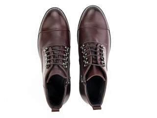 A pair of classic leather elegant men's shoes isolated white background. Groom's stylish black shoes. Isolated object close up on white background.