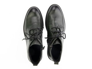 A pair of classic leather elegant men's shoes isolated white background. Groom's stylish black shoes. Isolated object close up on white background.