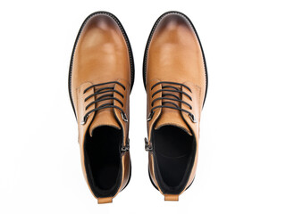 A pair of classic leather elegant men's shoes isolated white background. Groom's stylish black shoes. Isolated object close up on white background.