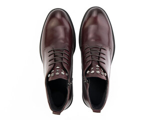 A pair of classic leather elegant men's shoes isolated white background. Groom's stylish black shoes. Isolated object close up on white background.