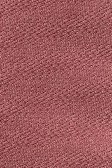 Fototapeta premium Mostly desaturated dark red color fabric cloth polyester texture and textile background.
