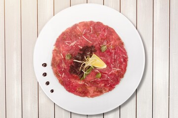 Traditional spanish jamon, prosciutto crudo, italian salami, parma ham on a plate.
