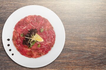 Traditional spanish jamon, prosciutto crudo, italian salami, parma ham on a plate.