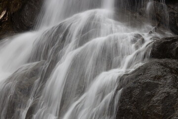 Fototapeta na wymiar waterfall in a spring forest