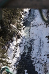 frozen snow covered rocky winter river