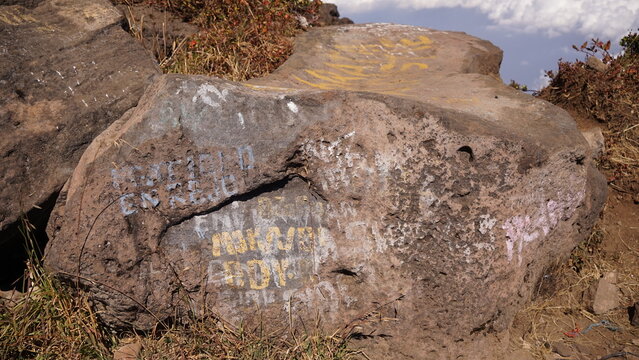 Vandalism at the top of Mount Arjuno. the stones are painted by anonymous. Mount Arjuno is next to Mount Welirang, located in Malang, East Java, Indonesia.