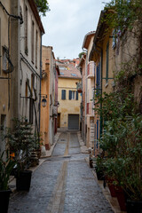 Fototapeta na wymiar Rainy day in South of France, narrow streets and colorful buildings in Cassis, Provence, France